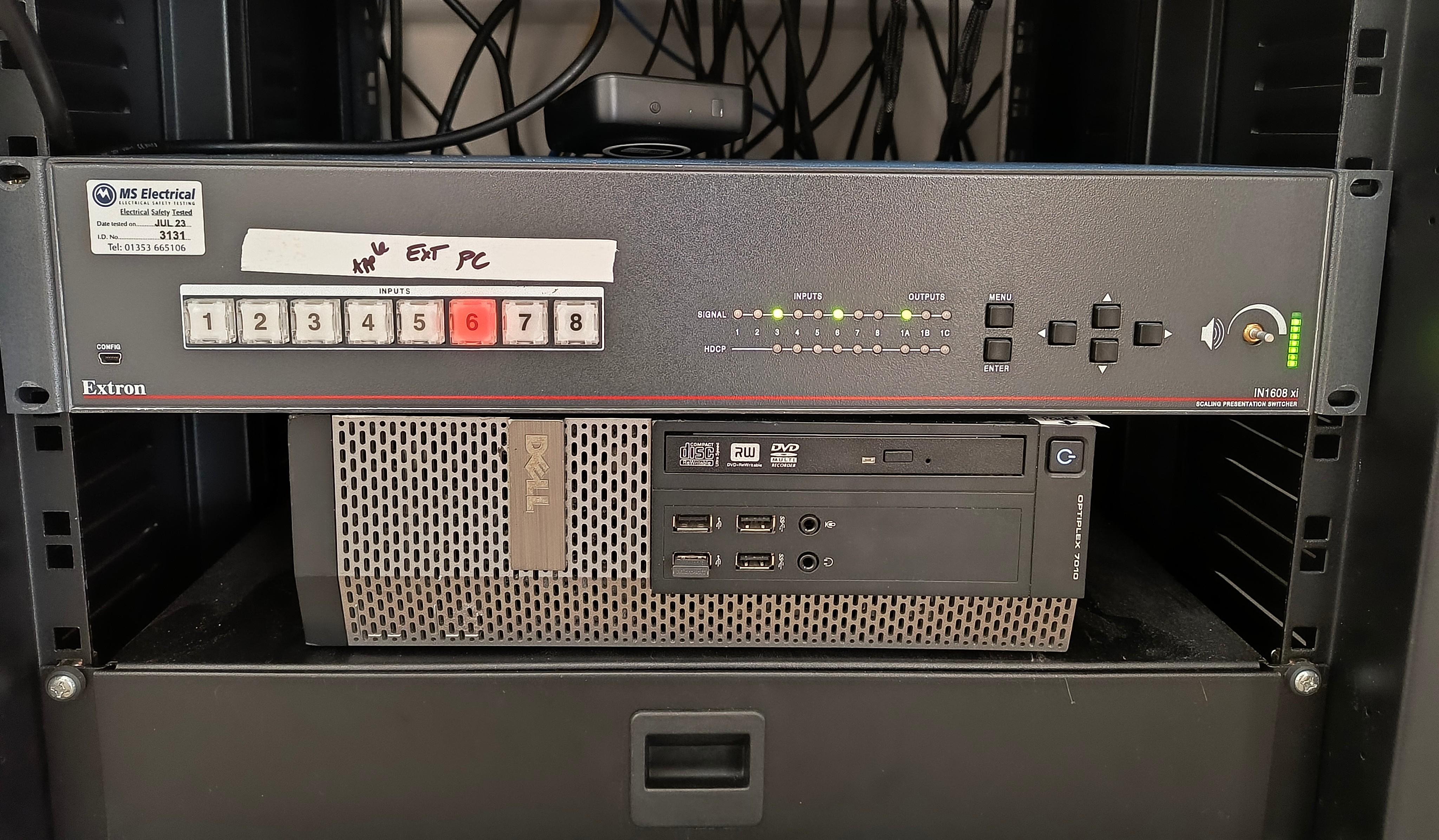 The switcher near the bottom of the rack, showing the PC input selected